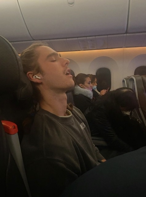 Kai-surviving-summer-sleeping-on-plane