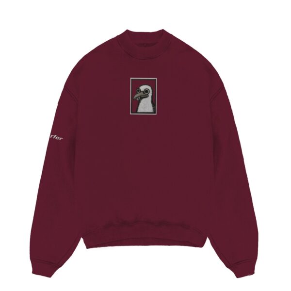 Maroon sweatshirt with an embroidered design of a seagull.
